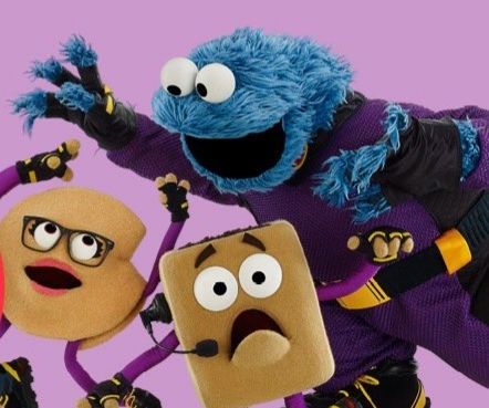 Sesame Street screenshot of Cookie Monster chasing 2 living cookies with limbs and faces.