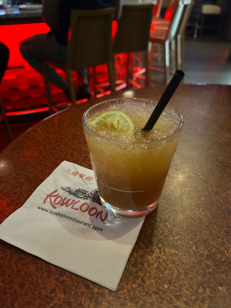 A brownish cocktail sitting on a table. 