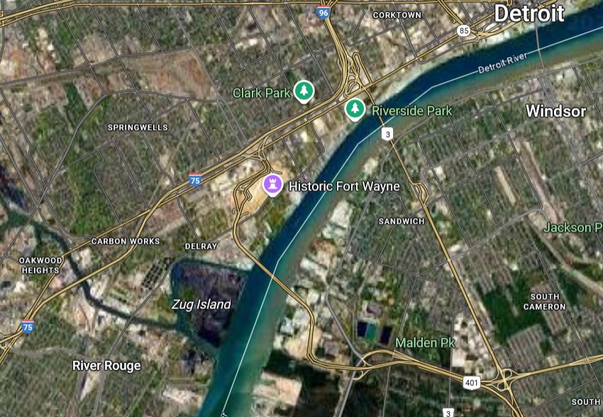 A satellite map of the Detroit-Windsor area. Zug Island is an almost completely dark spot on the map due to high pollution.