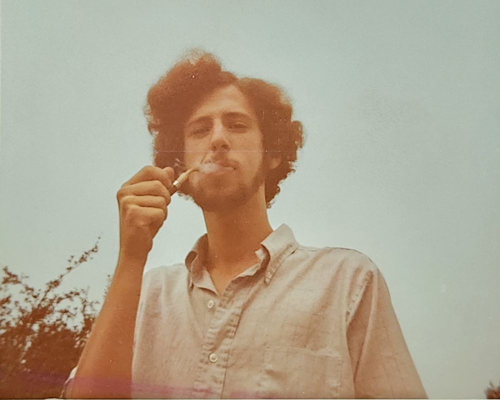 Photo of my dad when he was ~18 smoking a pipe and looking cool