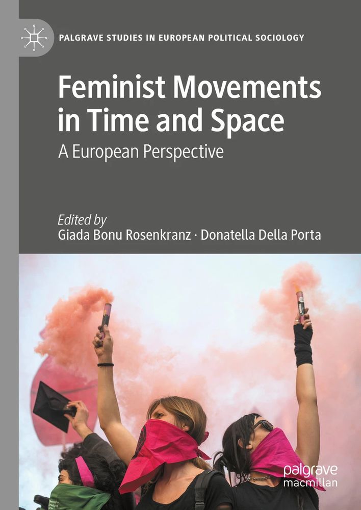 Women protestors raise pink flares high in the air