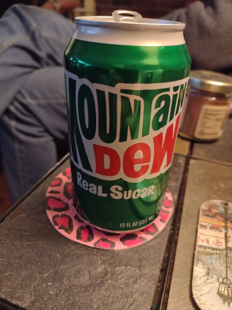 A can of real sugar Mountain Dew. 

