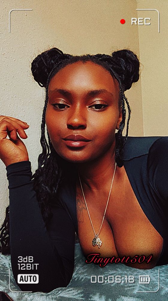Ebony mistress looking down on you with her huge rack is peeking out and pulling you in 