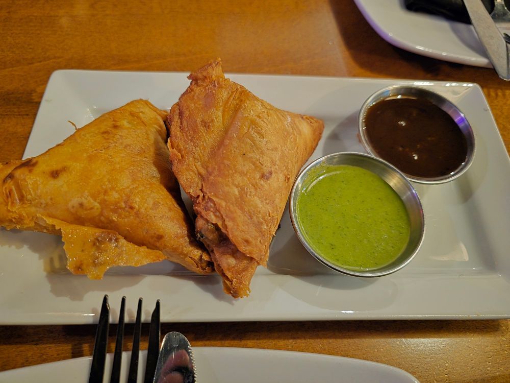 Samosas with tamarind sauce and mint