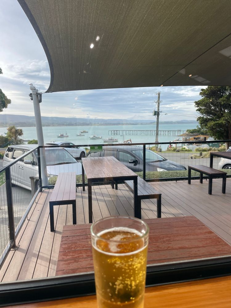 Zero alcohol Heiniken at Moeraki. View of wharf in background. 