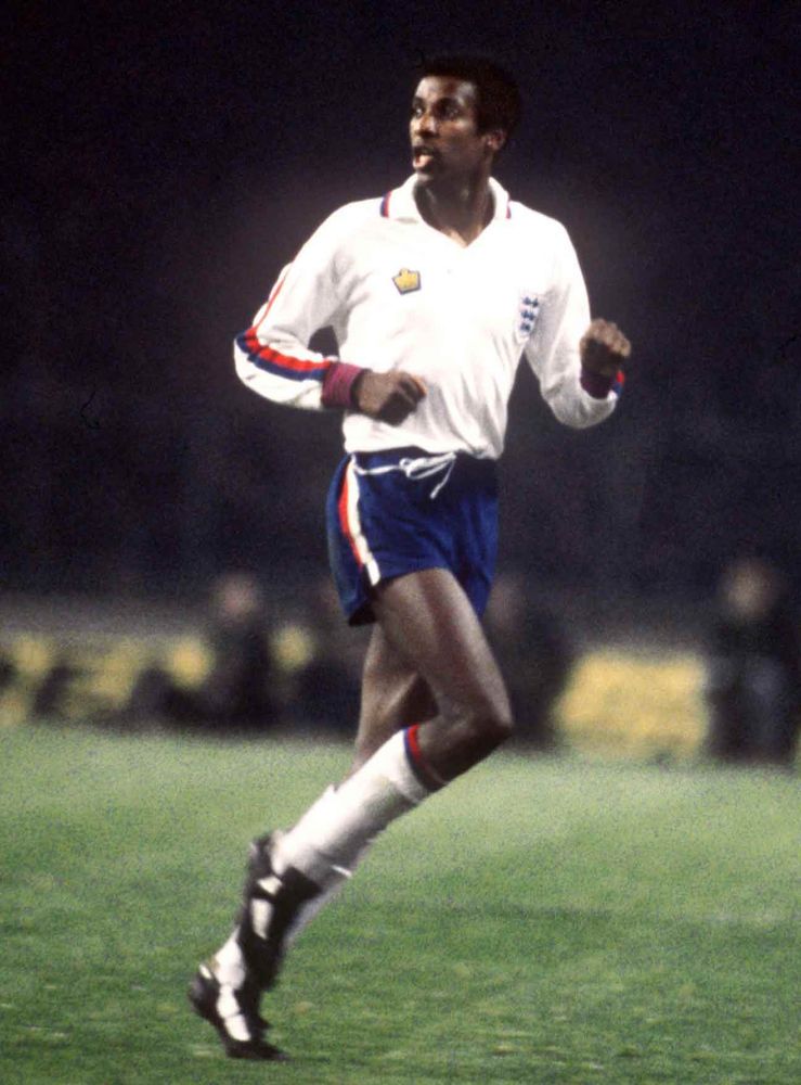 Viv Anderson in a white England shirt and blue shorts