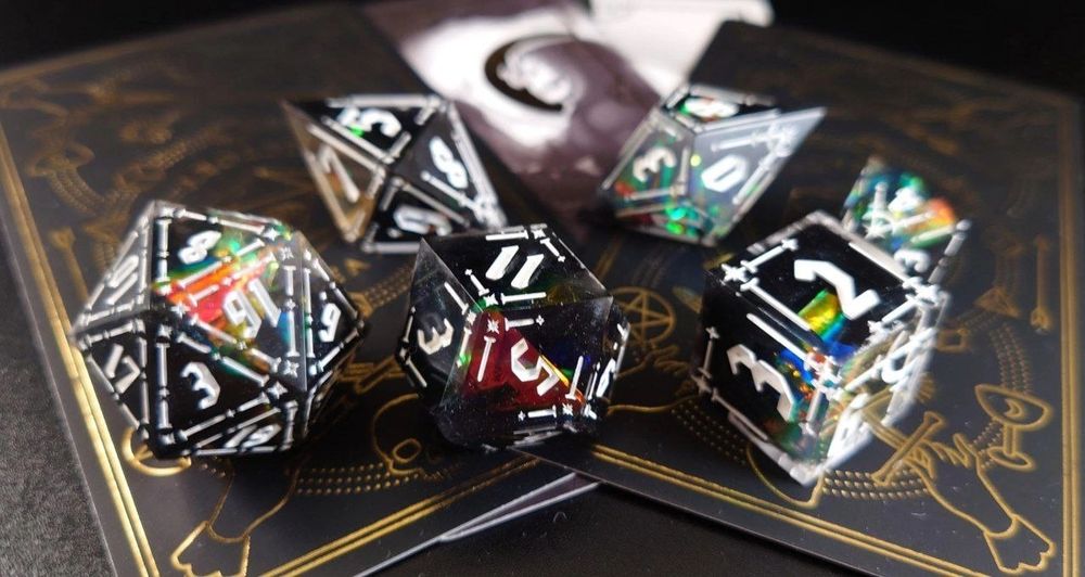 a black dice set with holographic sparkles and a star pattern