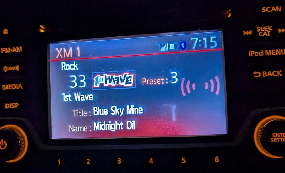 Pic of satellite radio showing the current track, which is Blue Sky Mine by Midnight Oil