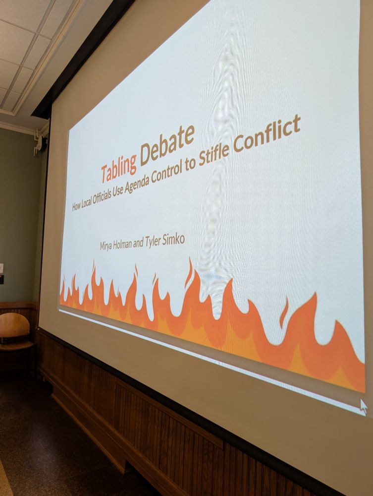 A picture of a slide that says Tabling Debates how local officials use agenda control to Stifle Conflict 
Mirya Holman and Tyler Simko
There are flames on the bottom of the slides 