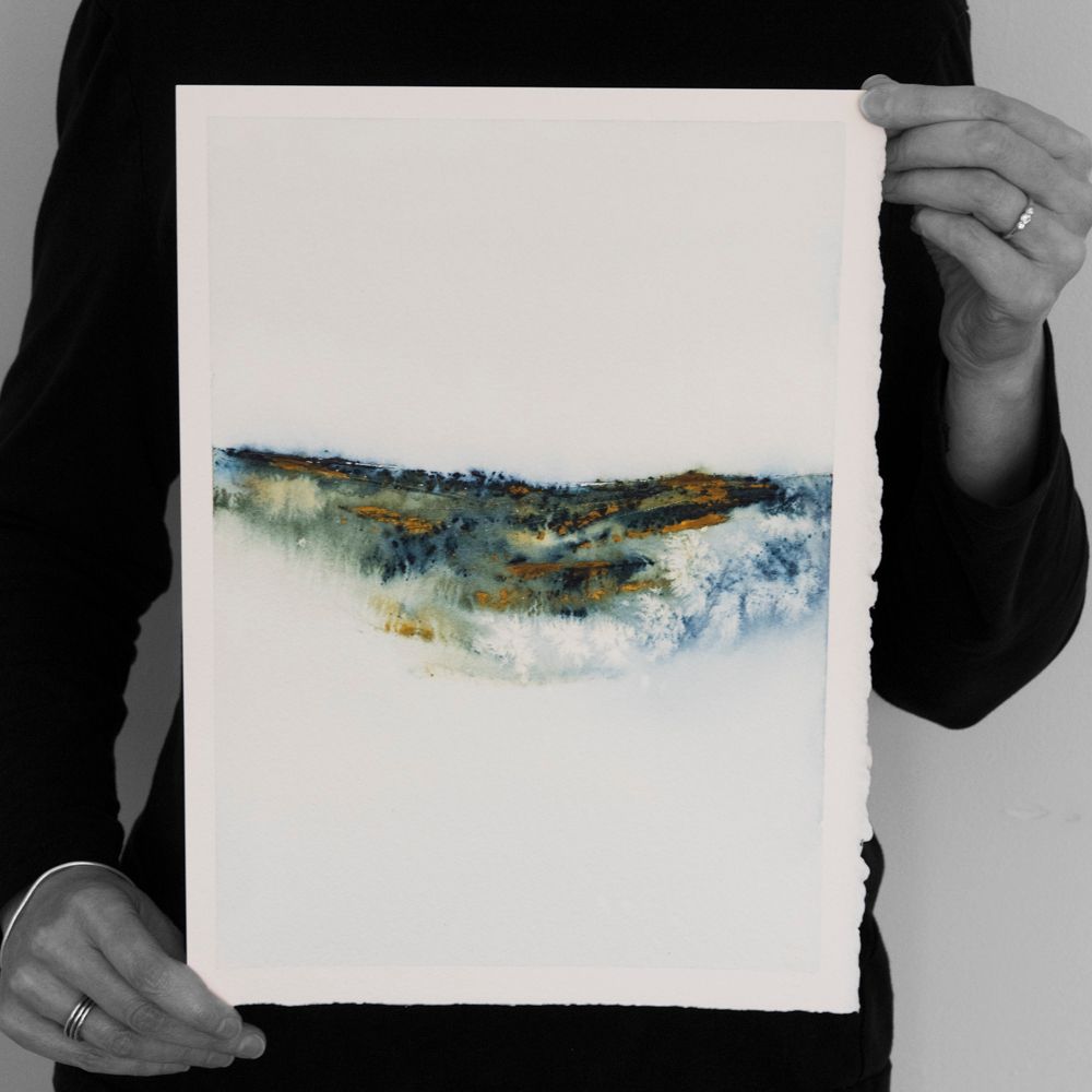Abstract landscape painting in watercolour paint on thick cotton paper with deckled edges. 