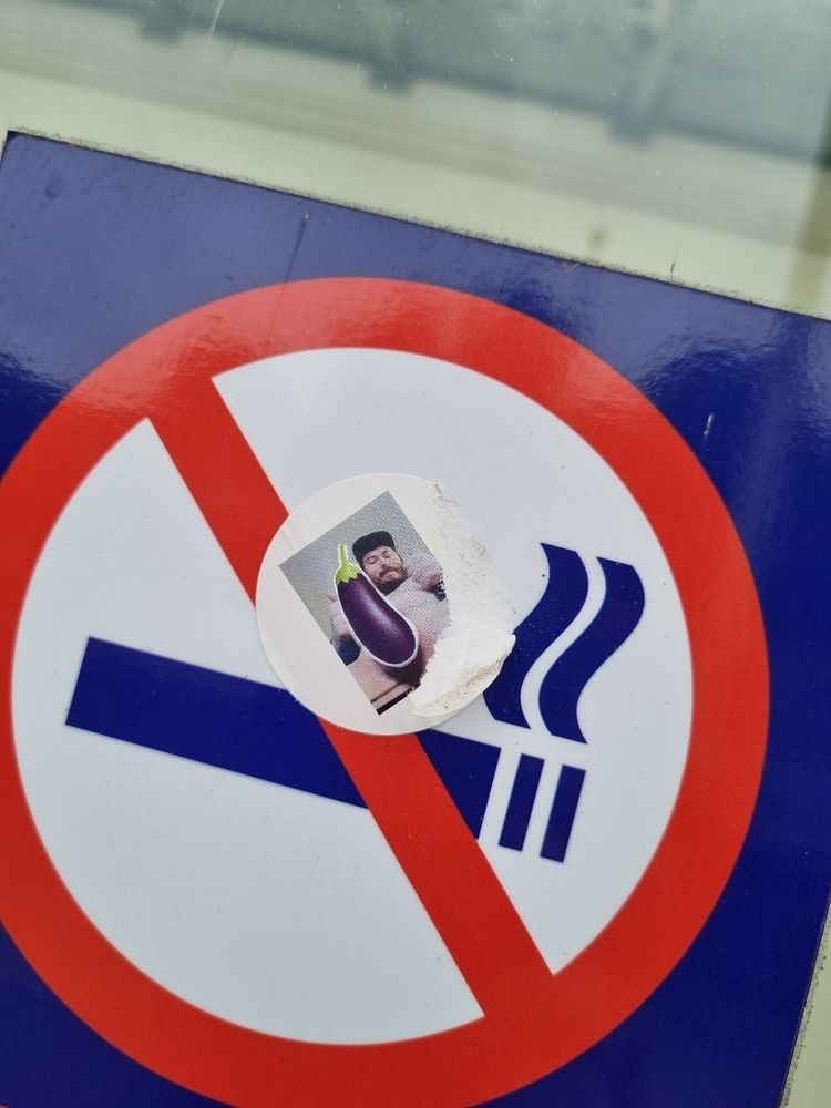 And then there's this (somewhat NSFW). One of the 'No Smoking' signs in the station has had a small sticker, about 2cm, placed over it. In other words, big enough to get your attention, but small enough that you have to go right up to it to see what it is. Surprise, the sticker is of a bearded man sat down and seen from below him. He's smiling and giving two thumbs up, and he's completely naked besides a baseball cap, but with the eggplant emoji 🍆 censoring his bits. No idea if it's a local or a celebrity I don't know of, but he seems pleased with himself
