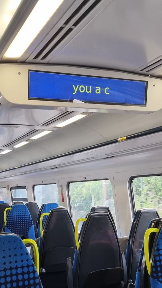 Photograph of a digital information display on a Northern train. The text is truncated, and so it just says 'you a c'