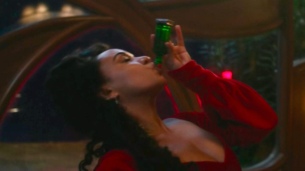Elphaba's mother drinking the green elixir