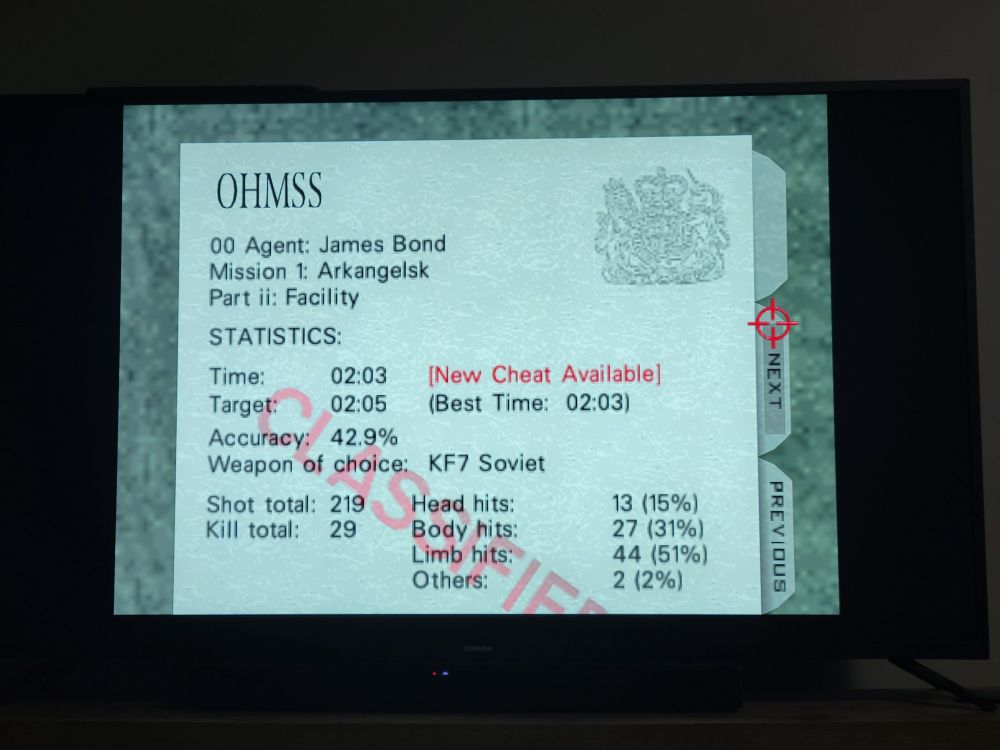GoldenEye 007 end-level screen for Facility with a time of 2:03