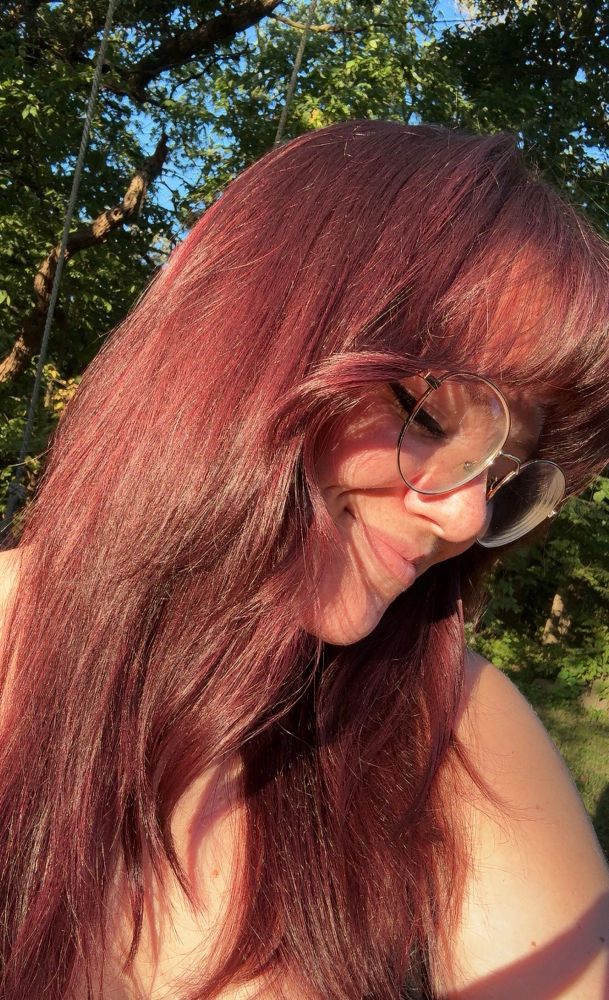 Me showing off my maroon hair in the sun 