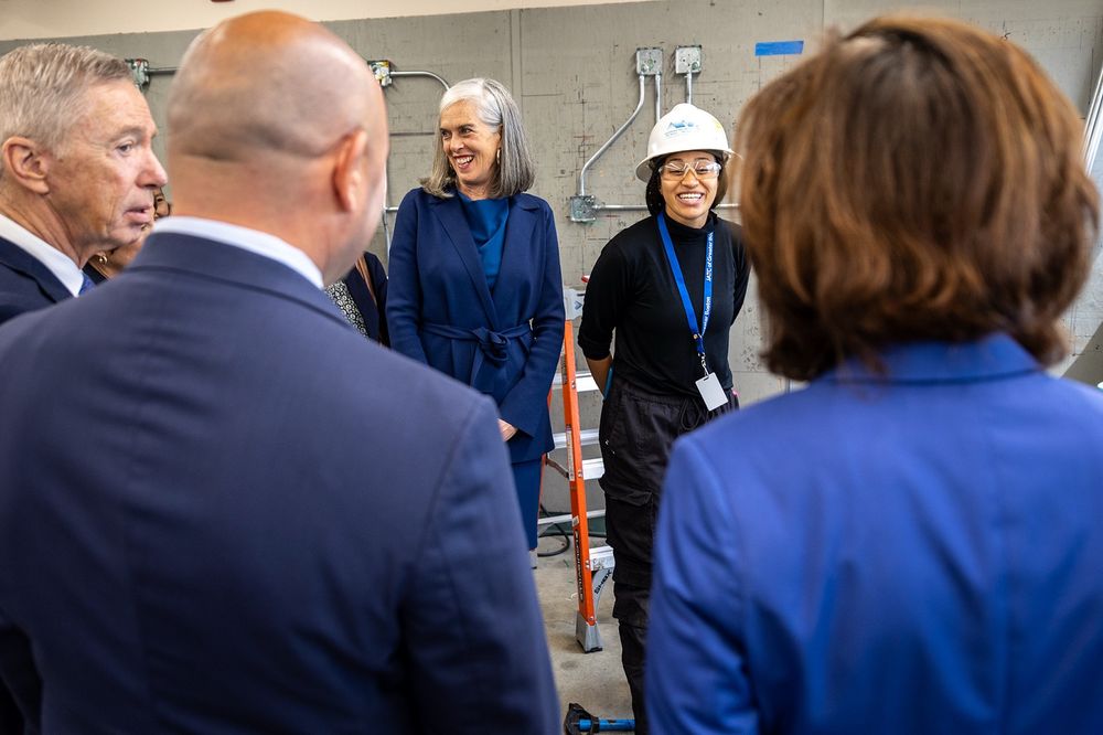 Whip Clark stands alongside workers in MA-5. 