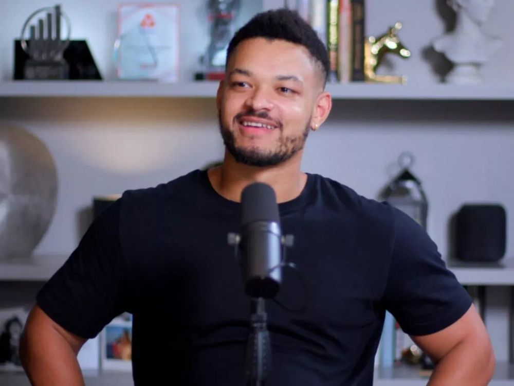 Gullible host of Diary of a CEO smiling inanely during an episode