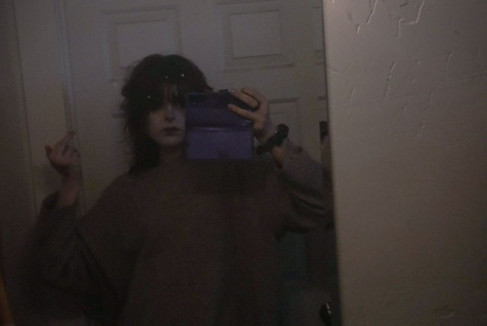 she has unfinished business,
she wants to move on, 
she's a  ghost in every practical sense of the word
love, always

a photo of me that is very underexposed,, in my bathroom, poor lighting and undersaturated. i probably look miserable. 