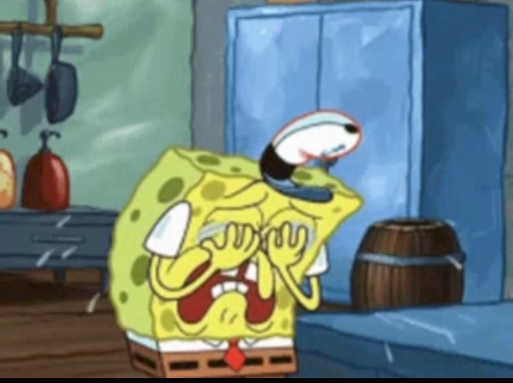 An image of SpongeBob holding his closed eyes and crying a lot