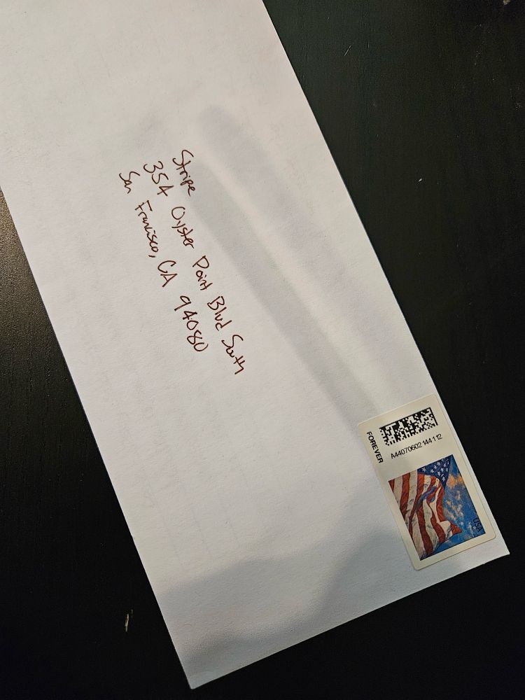 Photo of a stamped, hand addressed letter to Stripe