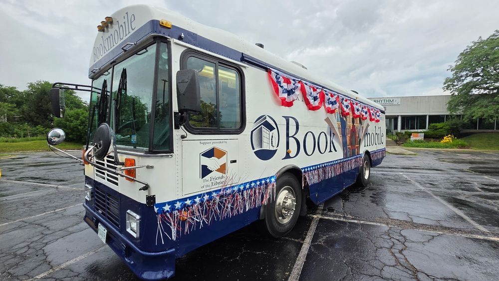 Photo of the Bookmobile in the rain before the Vernon Hills Fourth of July parade.