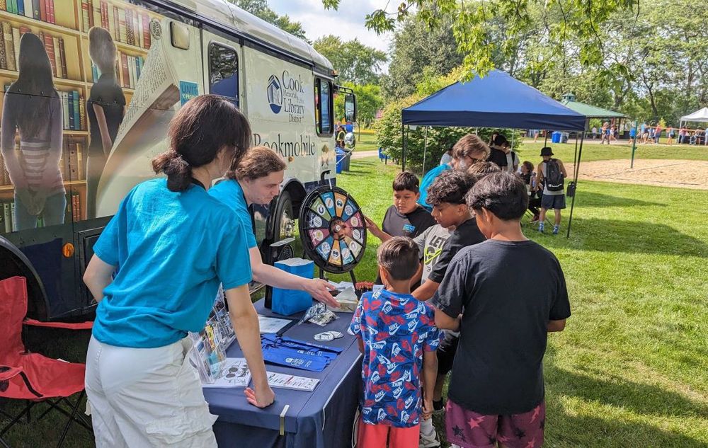 Photo of patrons interacting with the bookmobile.