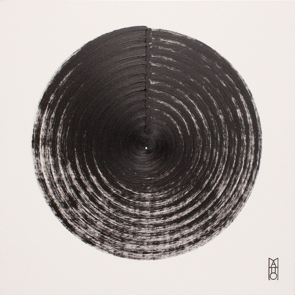 painting of concentric black circles on white, showing fading lines and textural depth.
