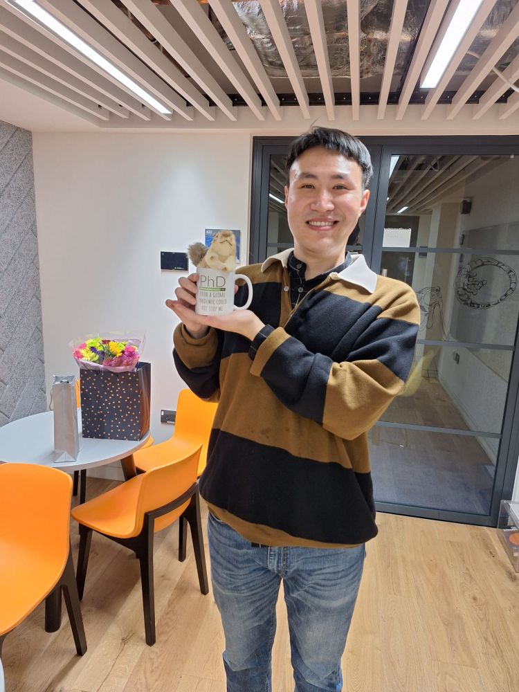 Post viva celebrations with Dr Jiayi Yi. Jiayi holding one of his PhD presents: a PhD mug and a cute chipmunk plush.