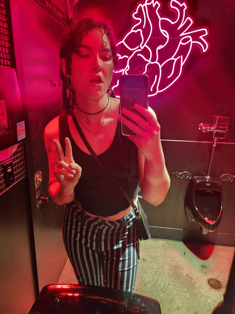 Selfie of Wyn in a bar bathroom