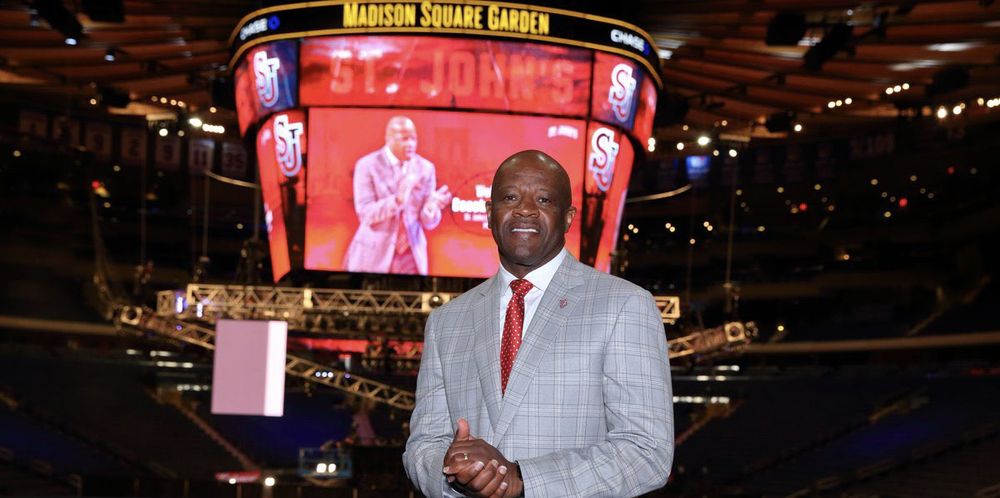 Mike Anderson posing in front of the Madison Square Garden Jumbotron during his introduction as St. John’s head coach in 2019