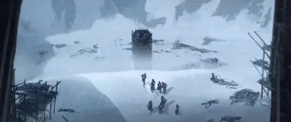 a group of people are walking through a snowy field in a cave .