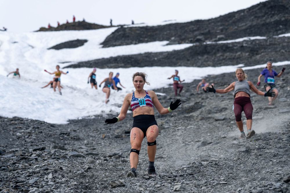 Tonia Baklanova and other women make their way down the mountain during the 97th running of the Mount Marathon Race on Friday, July 4, 2025 in Seward.