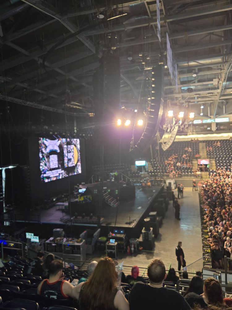 Photo of my view of the concert stadium stage a bit before the big show started, the lights are still on so you can see how crowded it was getting in there