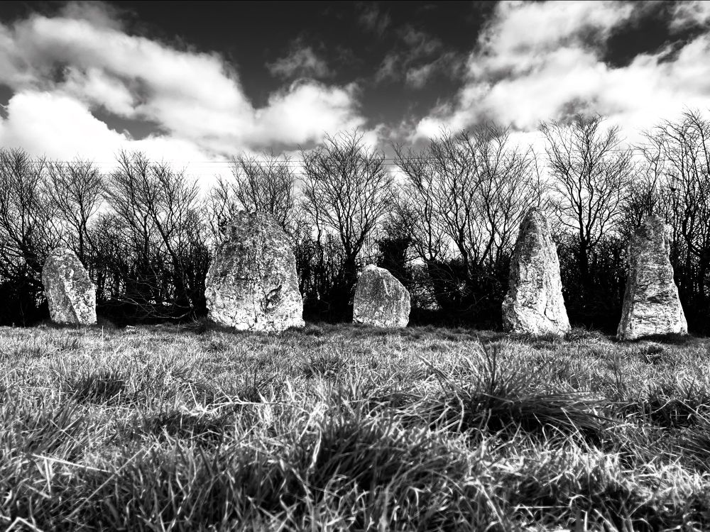 A black and white photo of Duloe stone circle in Cornwall