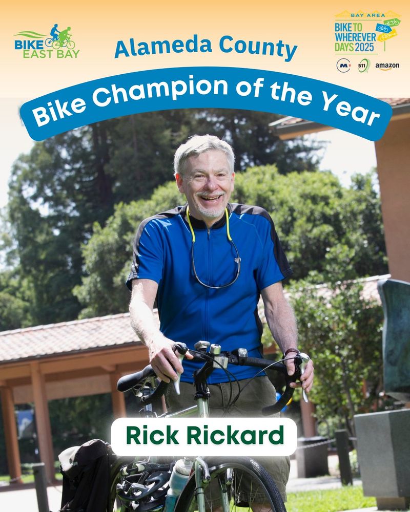 Rick Rickard of Alameda County smiles with his bicycle, in a well-lit outdoor space.