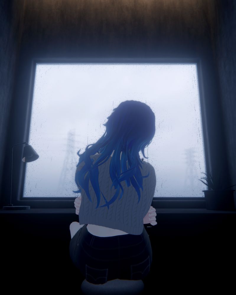 Girl sitting infront of a window