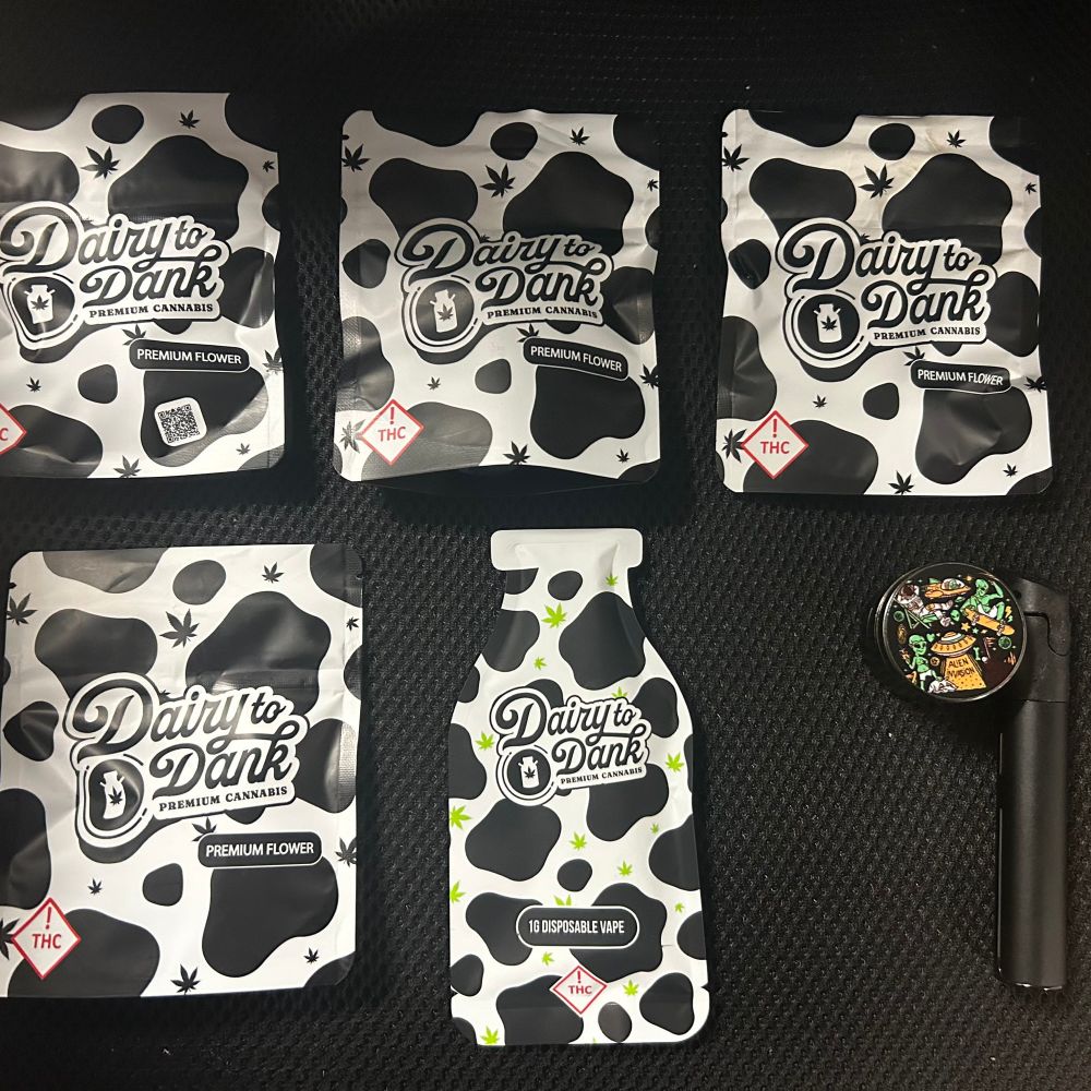 Four smol packs of flower. One vape one grinder