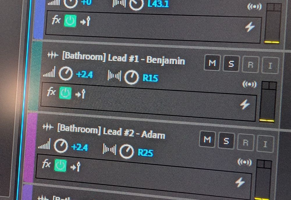Two tracks in audio editing software. One is labeled "[Bathroom] Lead #1 - Benjamin", the other "[Bathroom] Lead #2 - Adam". 