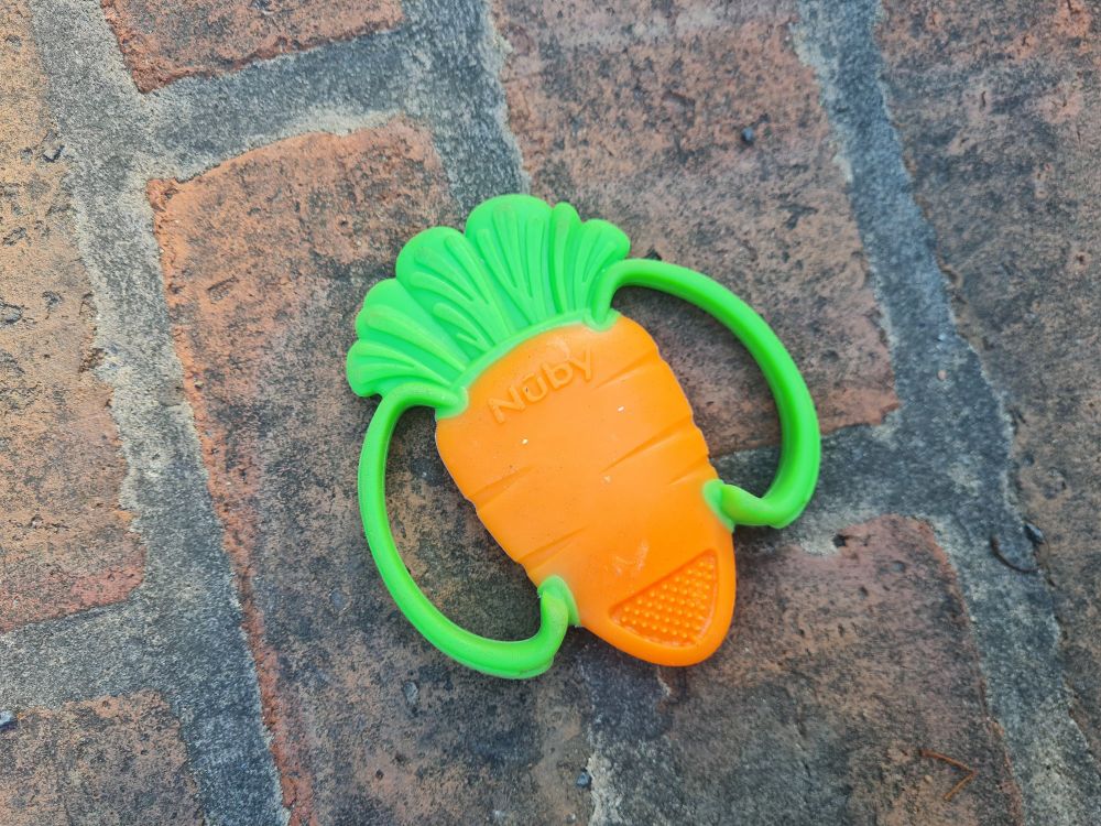 A child's chew toy on a wall.