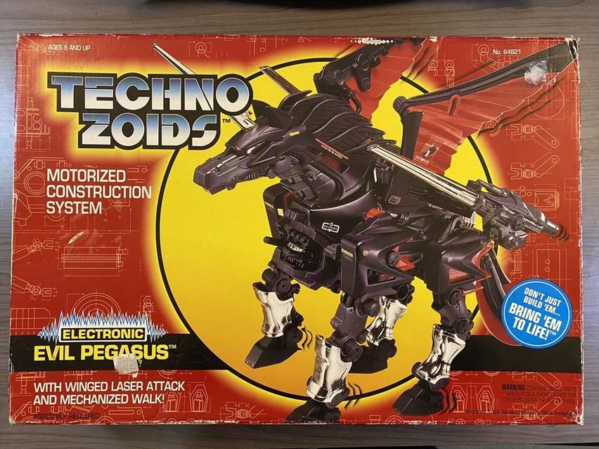 Dark Pegasus Technozoid box. Depicts a mechanical looking, black, red, and gold pegasus.