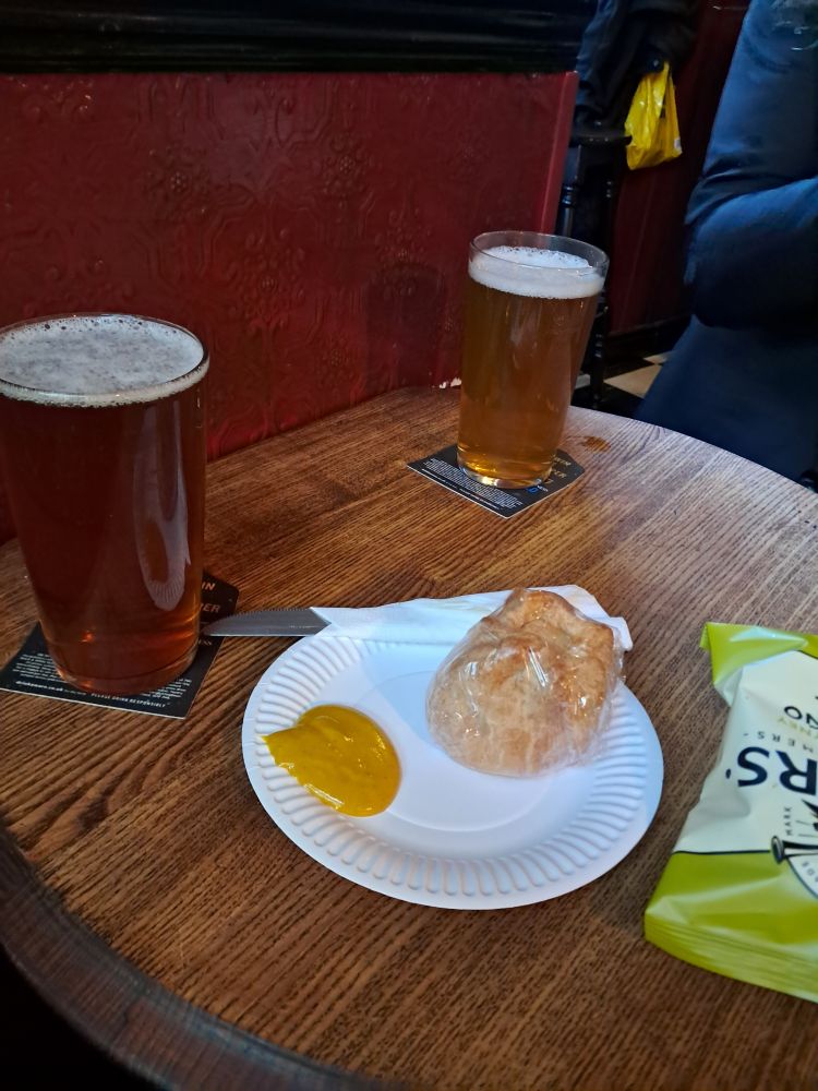 2 pints of beer, pork pie & mustard, bag of crisps