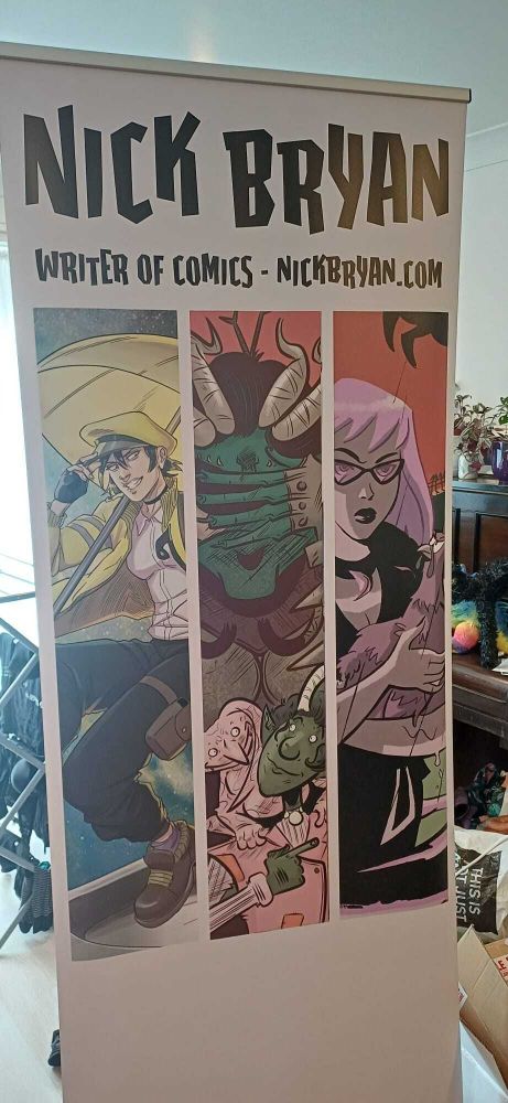 Stand-up convention banner - says "NICK BRYAN - WRITER OF COMICS - NICKBRYAN.COM" at the top.

Then three slices of art from Courier Z (by Lender Shell), Worrywart (by Lane Lloyd) and Death of a Necromancer (by Robert Ahmad).
