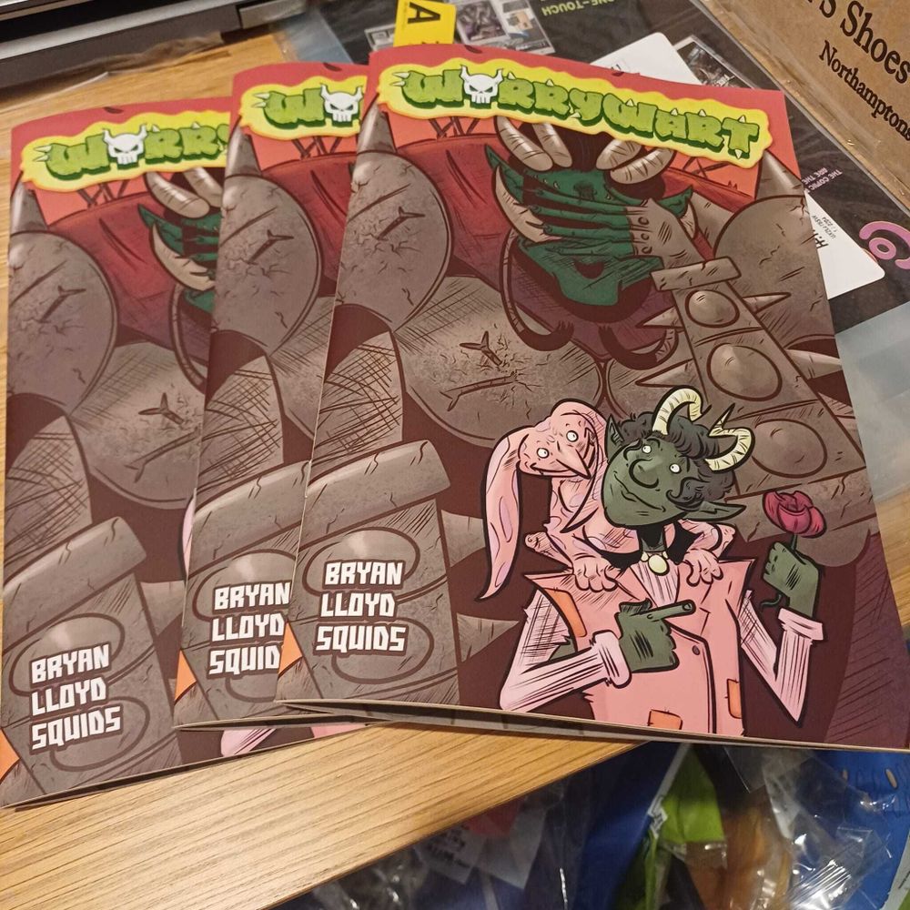 Three copies of the Worrywart comic on my dining room table.