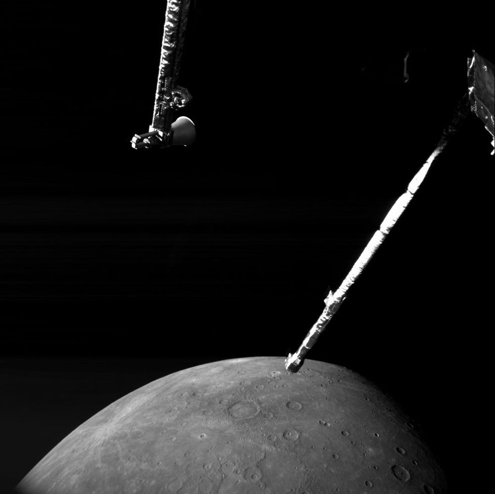 Part of spacecraft with Mercury in background.