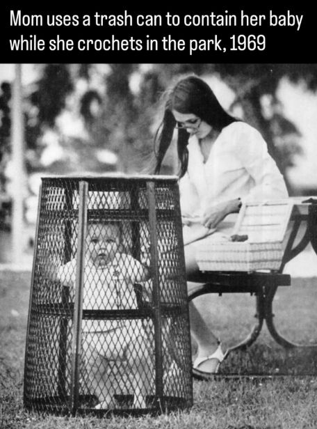 1969, baby in an upside down garbage basket while mom is busy.