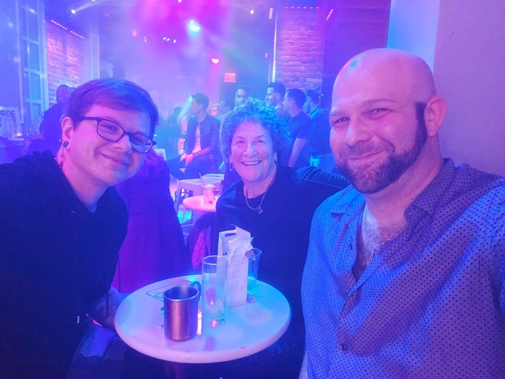 Jeremy, his mom Karen, and ex boyfriend Leo sitting at a table ar Rise Bar