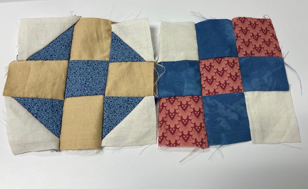 two 3 by 3 quilt squares. one is a blue and brown star pattern, one is a pink and blue block pattern. 