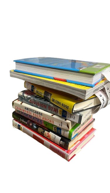 a stack of 9 books of varying sizes and shapes