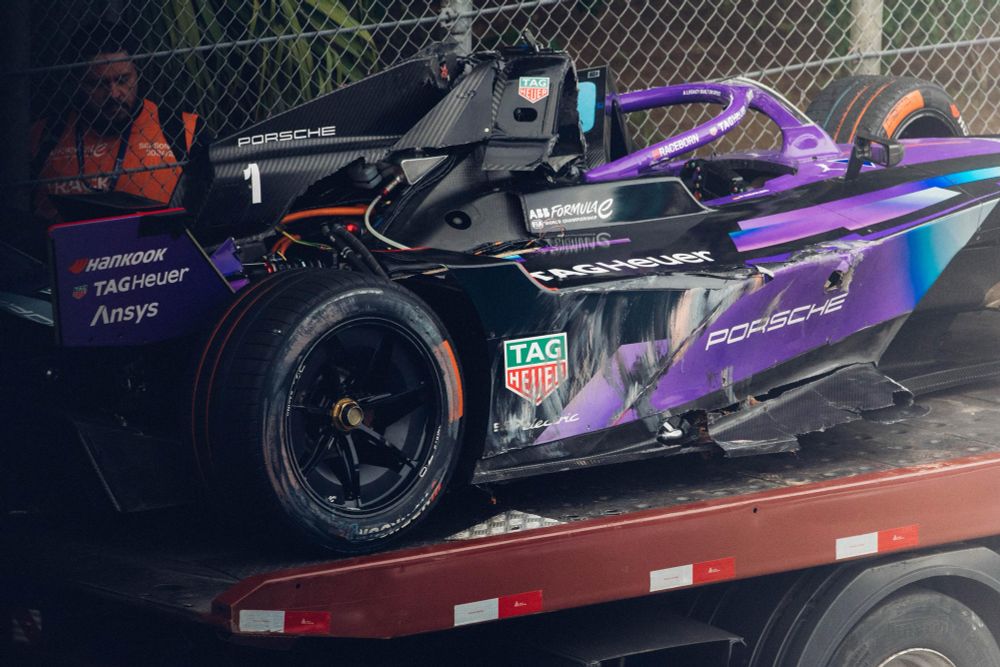 Pascal Wehrlein’s Porsche Fornula E car after being recovered. There’s significant damage to the car’s roll hoop, halo and side. 