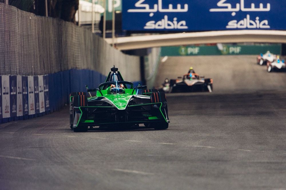 The green Envision Racing Formula E car of Sebastian Buemi leads a pack of cars during the first practice session of the season. 